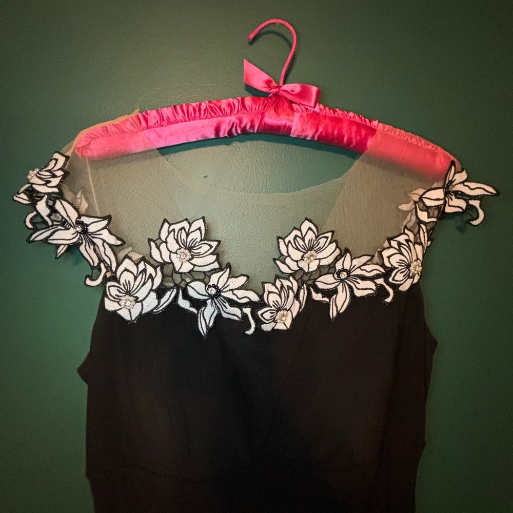 Long black formal dress with white floral detail neckline